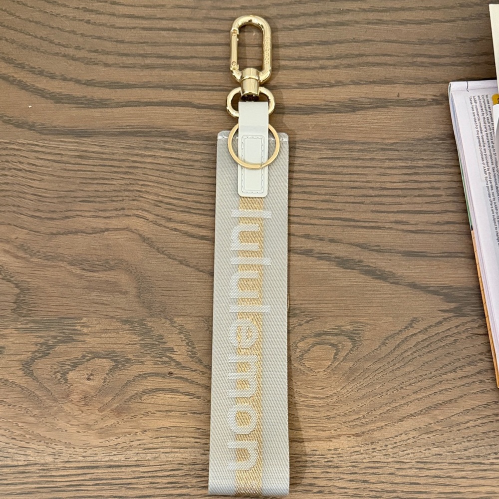 Lululemon Never Lost Keychain in Color Vapor/Gold